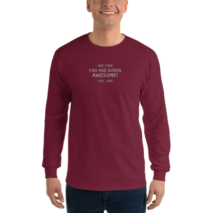 "Hey You! You are doing awesome! (Yes, you)" printed on a maroon men's long sleeve shirt worn by a male