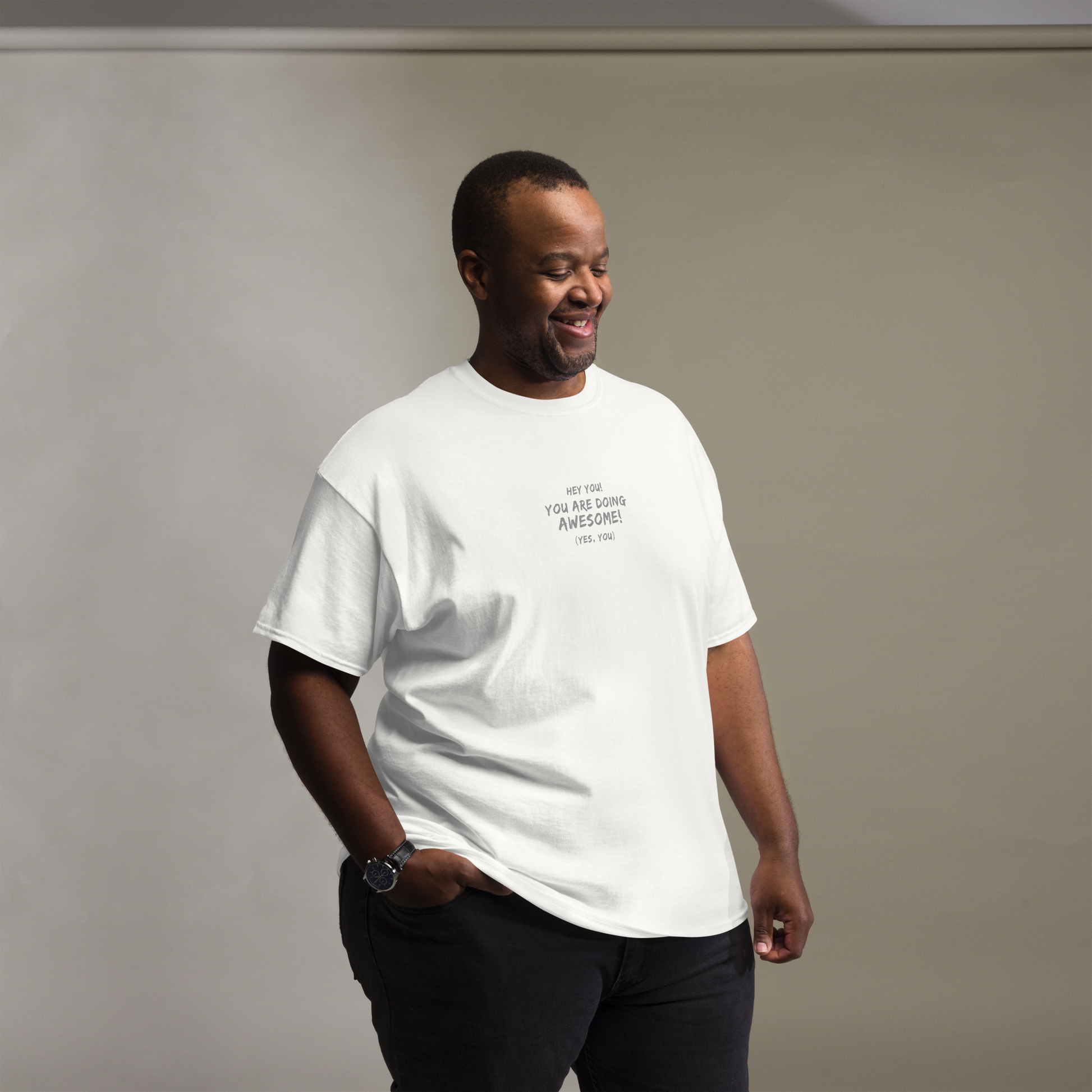 "Hey You! You are doing awesome! (Yes, you)" printed on a white unisex classic tee worn by a male
