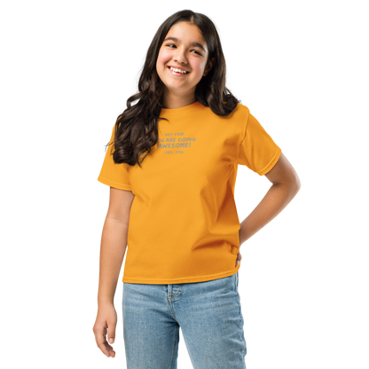 "Hey You! You are doing awesome! (Yes, you)" printed on a gold youth classic tee worn by a female