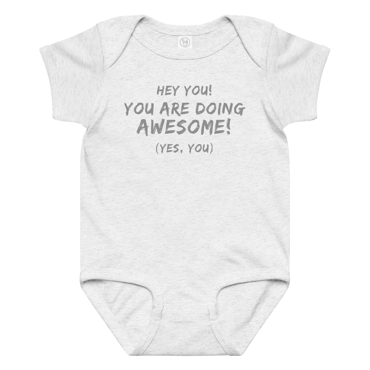 "Hey You! You are doing awesome! (Yes, you)" printed on a ash baby jersey bodysuit laying on a flat surface amongst other clothes
