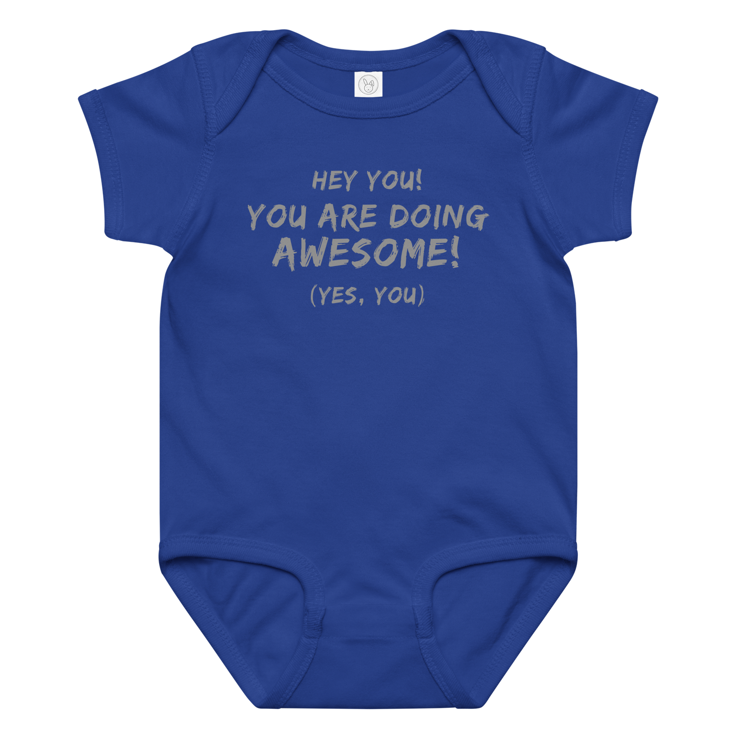 "Hey You! You are doing awesome! (Yes, you)" printed on a royal baby jersey bodysuit laying on a flat surface amongst other clothes