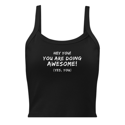 "Hey You! You are doing awesome! (Yes, you)" printed on a solid black blend women's micro-rib tanktop laying on a flat surface