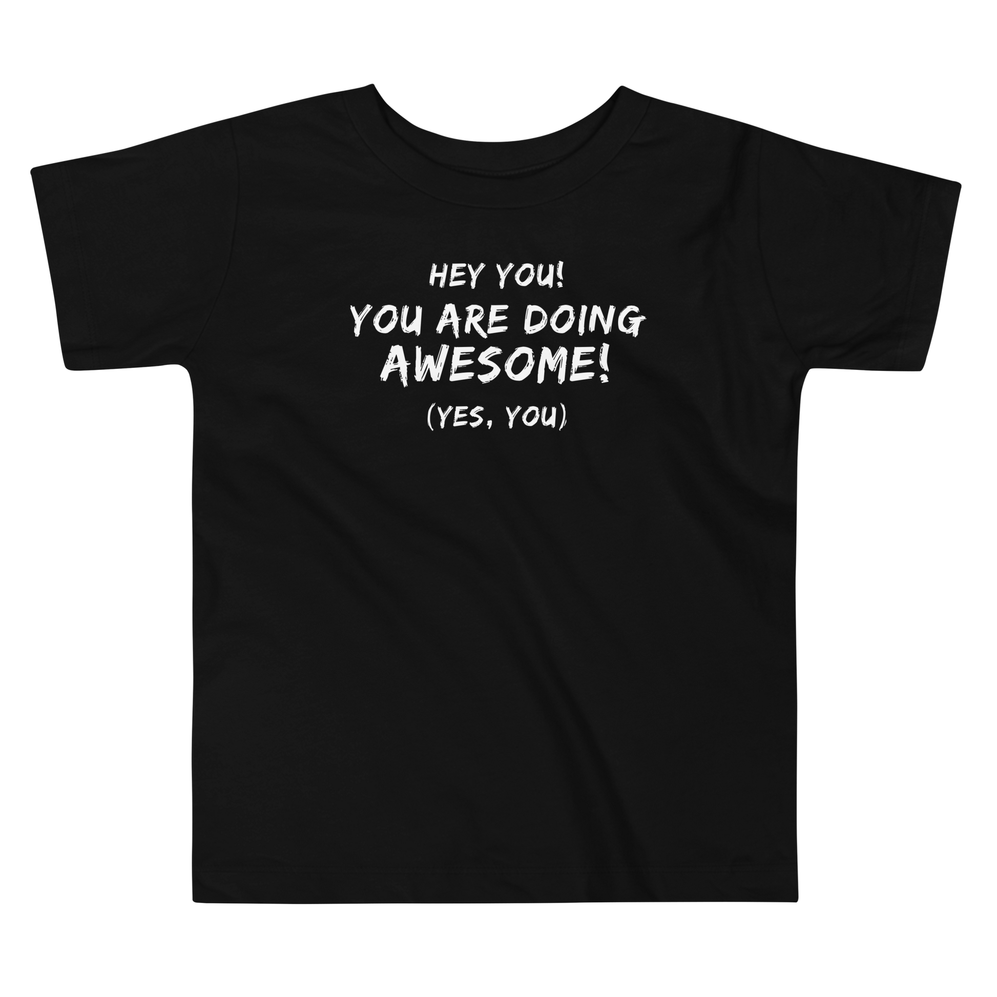 "Hey You! You are doing awesome! (Yes, you)" printed on a black toddler short sleeve tee laying on a flat surface