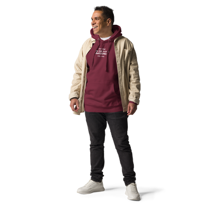 "Hey You! You are doing awesome! (Yes, you)" printed on a maroon unisex hoodie worn by a male with a jacket on top