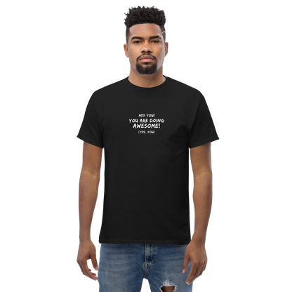"Hey You! You are doing awesome! (Yes, you)" printed on a black unisex classic tee worn by a male