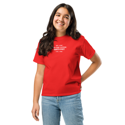 "Hey You! You are doing awesome! (Yes, you)" printed on a red youth classic tee worn by a female