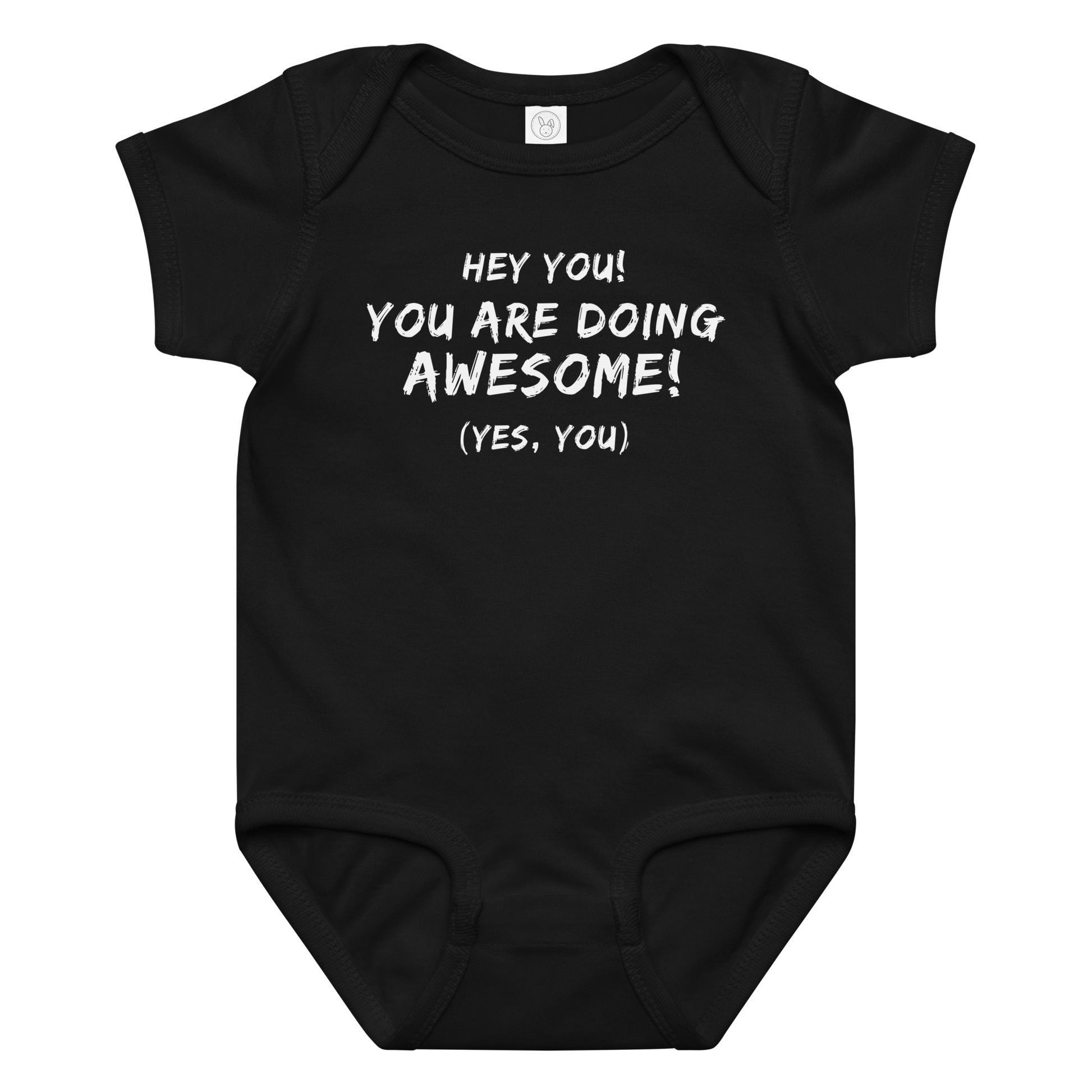 "Hey You! You are doing awesome! (Yes, you)" printed on a black baby jersey bodysuit laying on a flat surface amongst other clothes