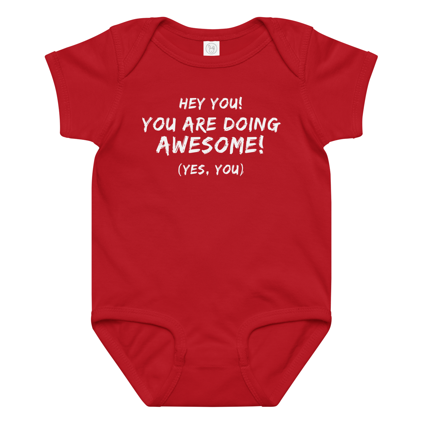 "Hey You! You are doing awesome! (Yes, you)" printed on a red baby jersey bodysuit laying on a flat surface amongst other clothes