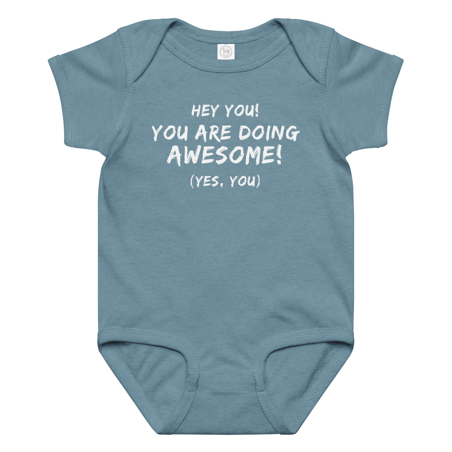 "Hey You! You are doing awesome! (Yes, you)" printed on a vintage indigo baby jersey bodysuit laying on a flat surface amongst other clothes