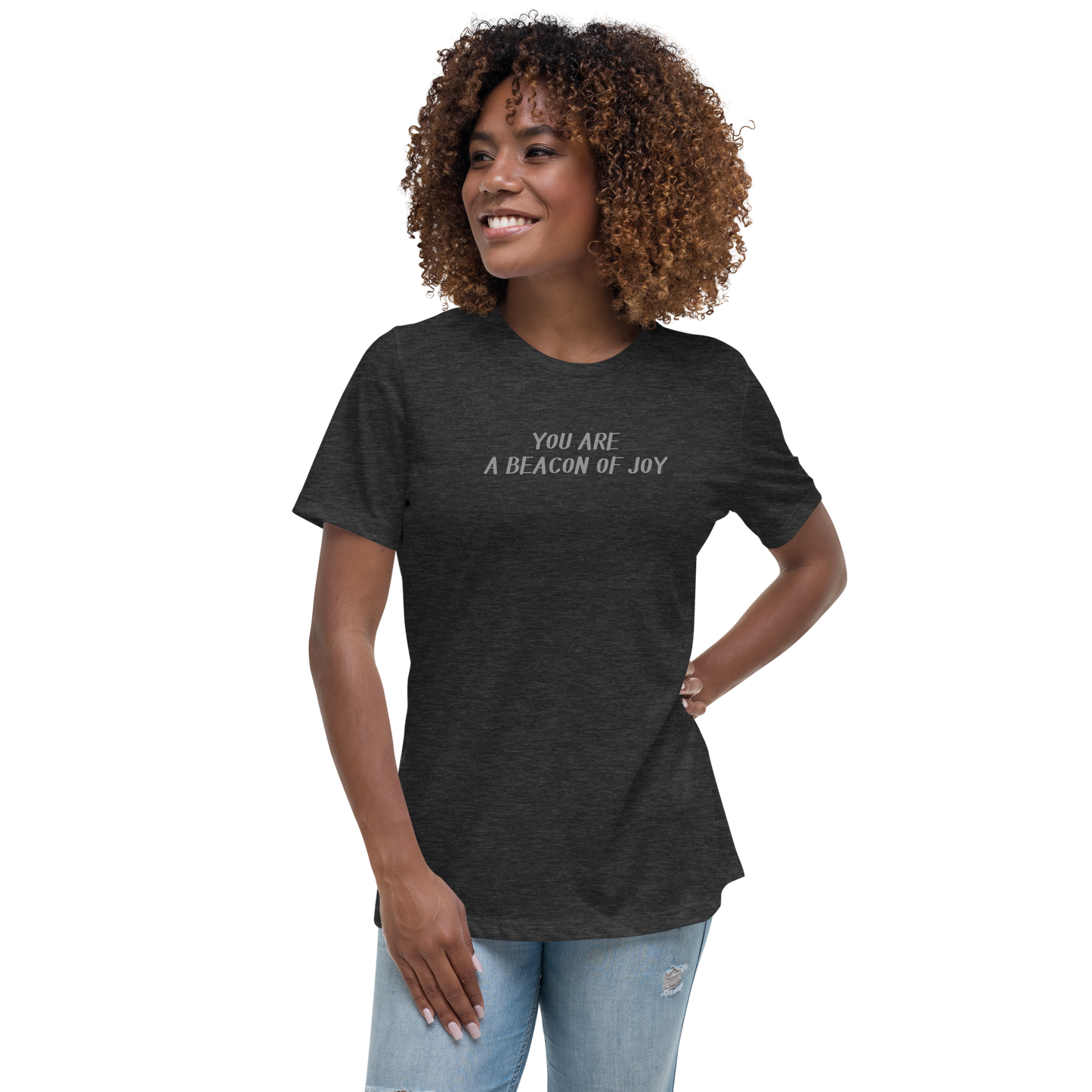 "You are a beacon of joy" printed on a dark grey heather women's relaxed t-shirt worn by a female