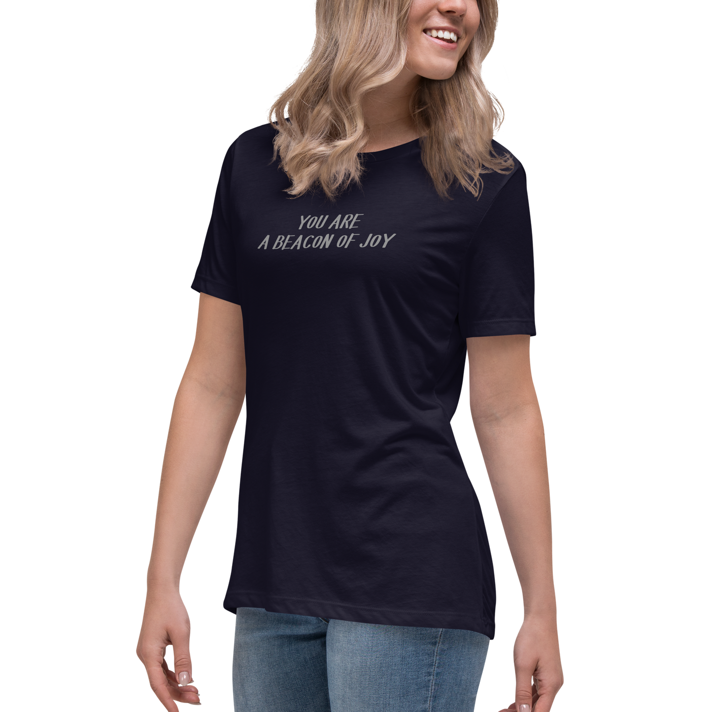 "You are a beacon of joy" printed on a navy women's relaxed t-shirt worn by a female