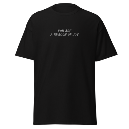 "You are a beacon of joy" printed on a black on an invisible body