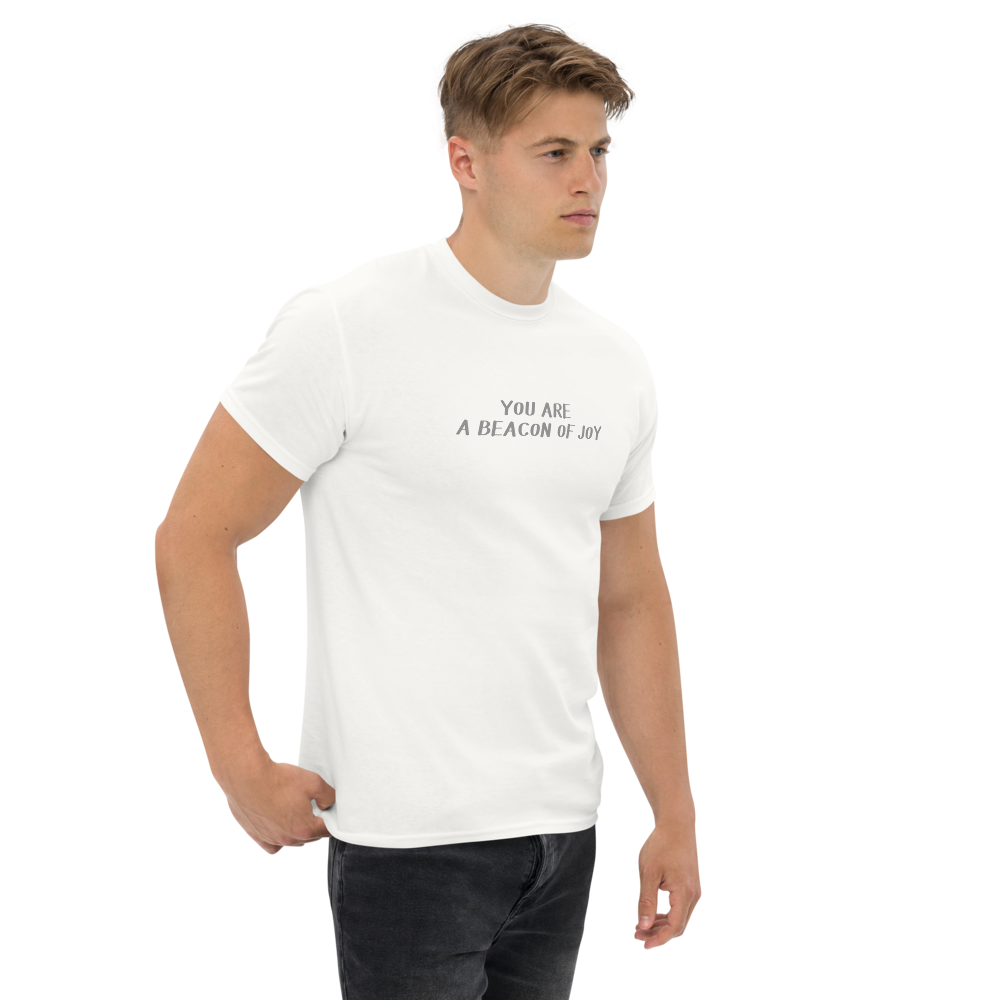 "You are a beacon of joy" printed on a white unisex classic tee worn by a male