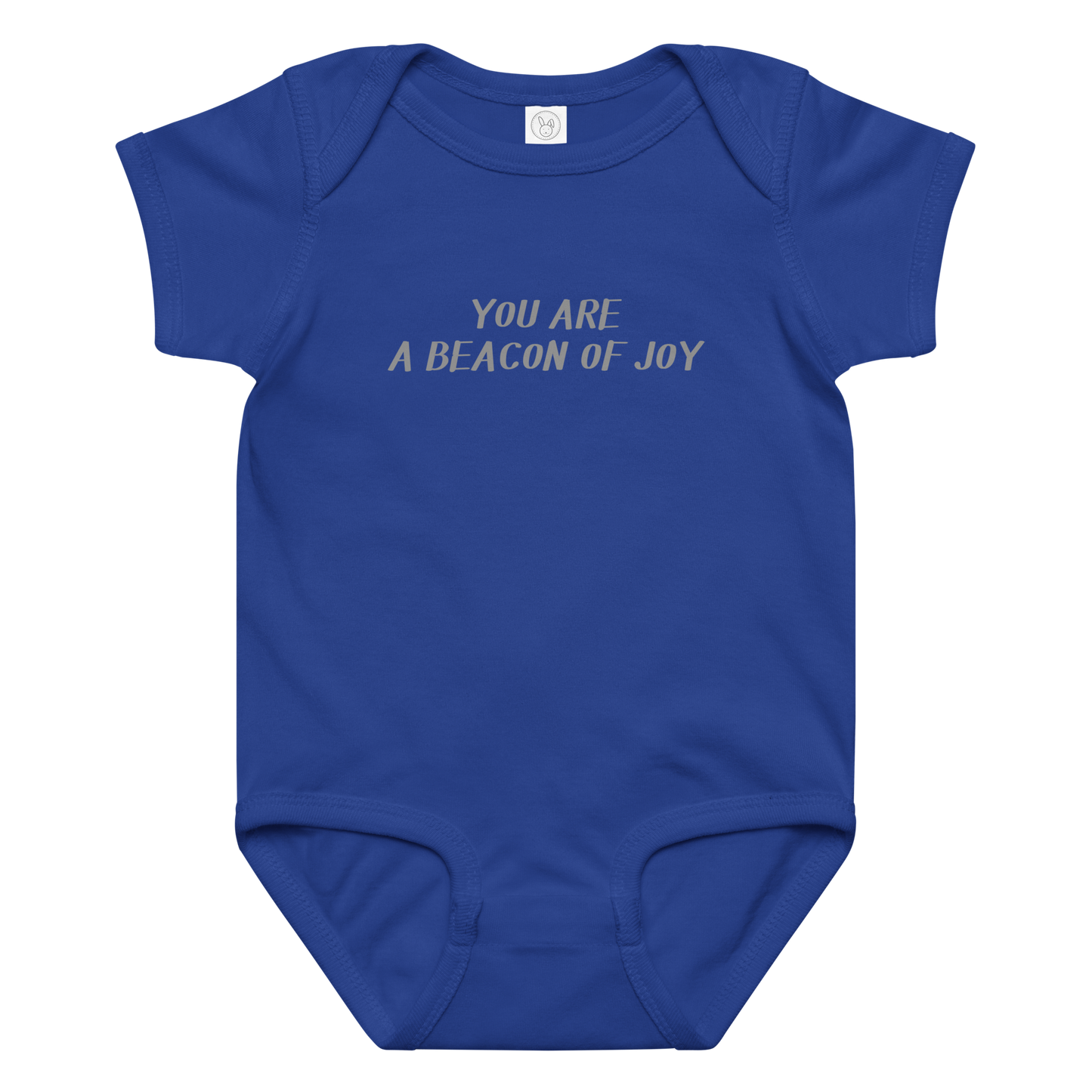 "You are a beacon of joy" printed on a royal baby jersey bodysuit laying on a flat surface amongst other clothes