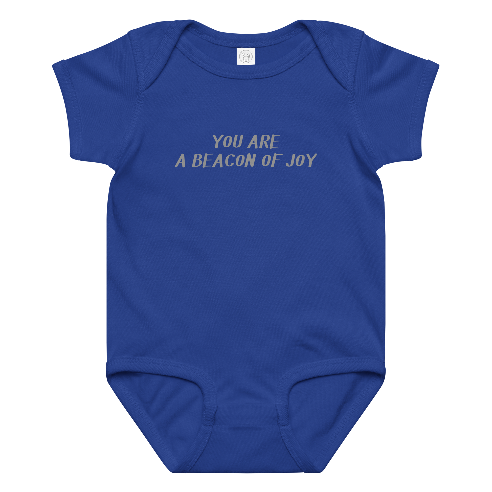 "You are a beacon of joy" printed on a royal baby jersey bodysuit laying on a flat surface amongst other clothes