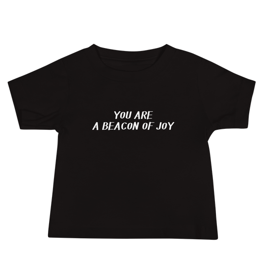 "You are a beacon of joy" printed on a black baby jersey short sleeve tee laying on a flat surface