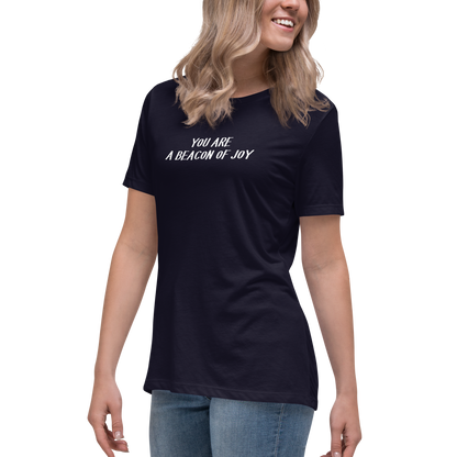 "You are a beacon of joy" printed on a navy women's relaxed t-shirt worn by a female