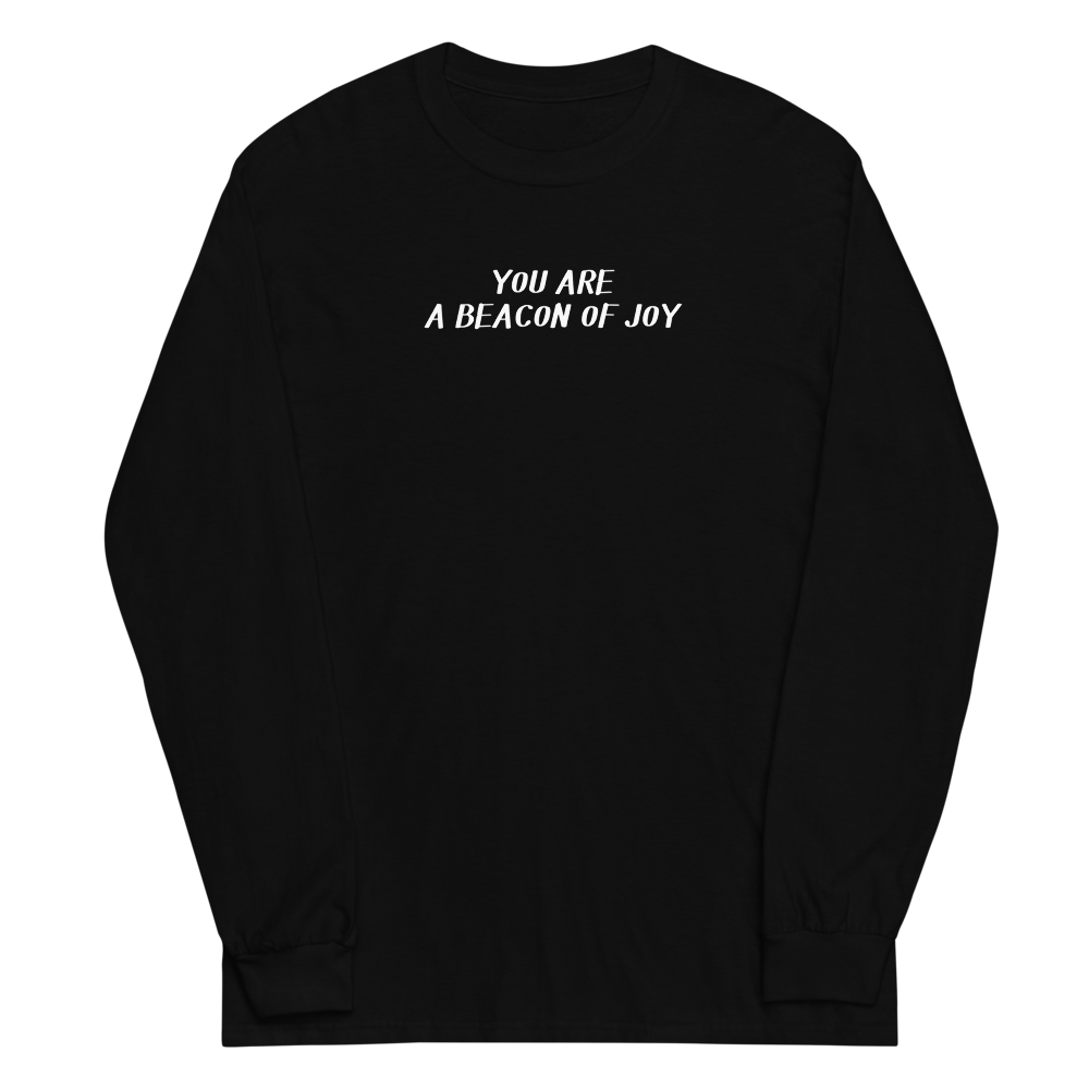 "You are a beacon of joy" printed on a black men's long sleeve shirt laying on a flat surface