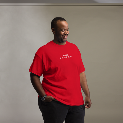 "You are a beacon of joy" printed on a red unisex classic tee worn by a male