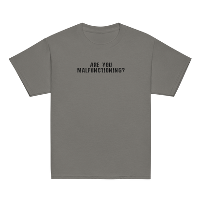 "Are you malfunctioning?" printed on a charcoal youth classic tee laying on a flat surface