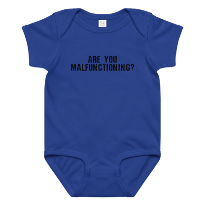 "Are you malfunctioning?" printed on a royal baby jersey bodysuit laying on a flat surface amongst other clothes