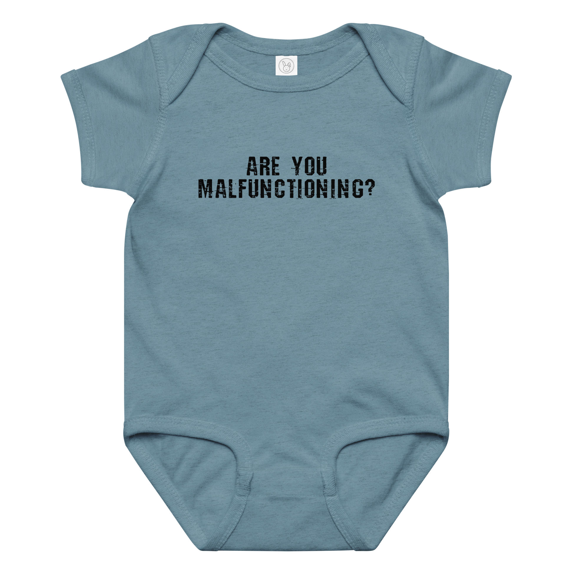 "Are you malfunctioning?" printed on a vintage indigo baby jersey bodysuit laying on a flat surface amongst other clothes