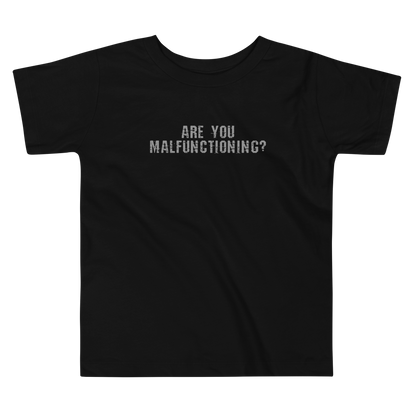 "Are you malfunctioning?" printed on a black toddler short sleeve tee laying on a flat surface
