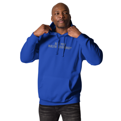 "Are you malfunctioning?" printed on a team royal unisex hoodie worn by a male