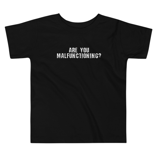 "Are you malfunctioning?" printed on a black toddler short sleeve tee laying on a flat surface