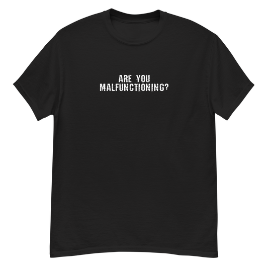 "Are you malfunctioning?" printed on a black unisex classic tee laying on a flat surface