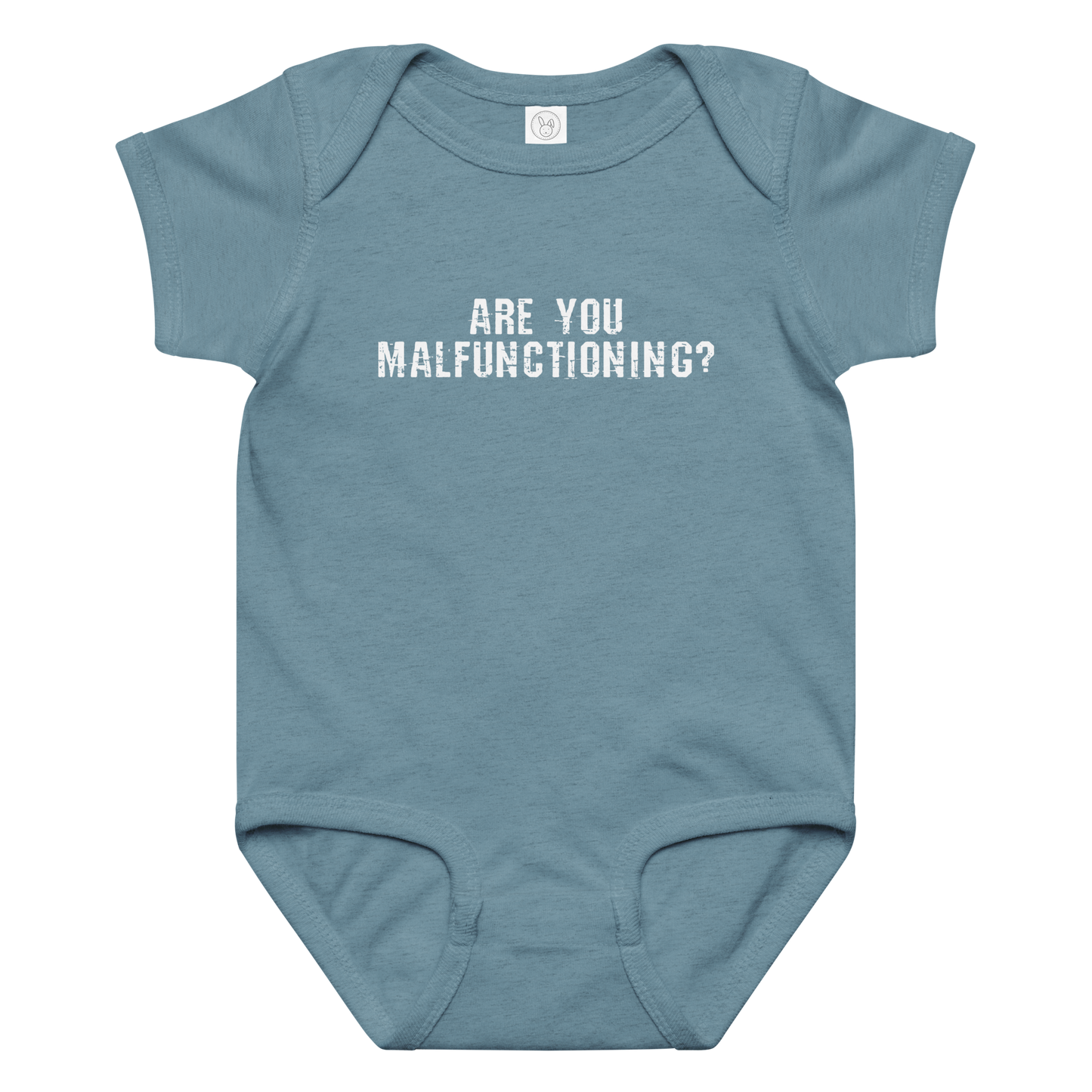 "Are you malfunctioning?" printed on a vintage indigo baby jersey bodysuit laying on a flat surface amongst other clothes