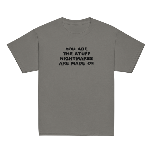 "You are the stuff nightmares are made of" printed on a charcoal youth classic tee laying on a flat surface