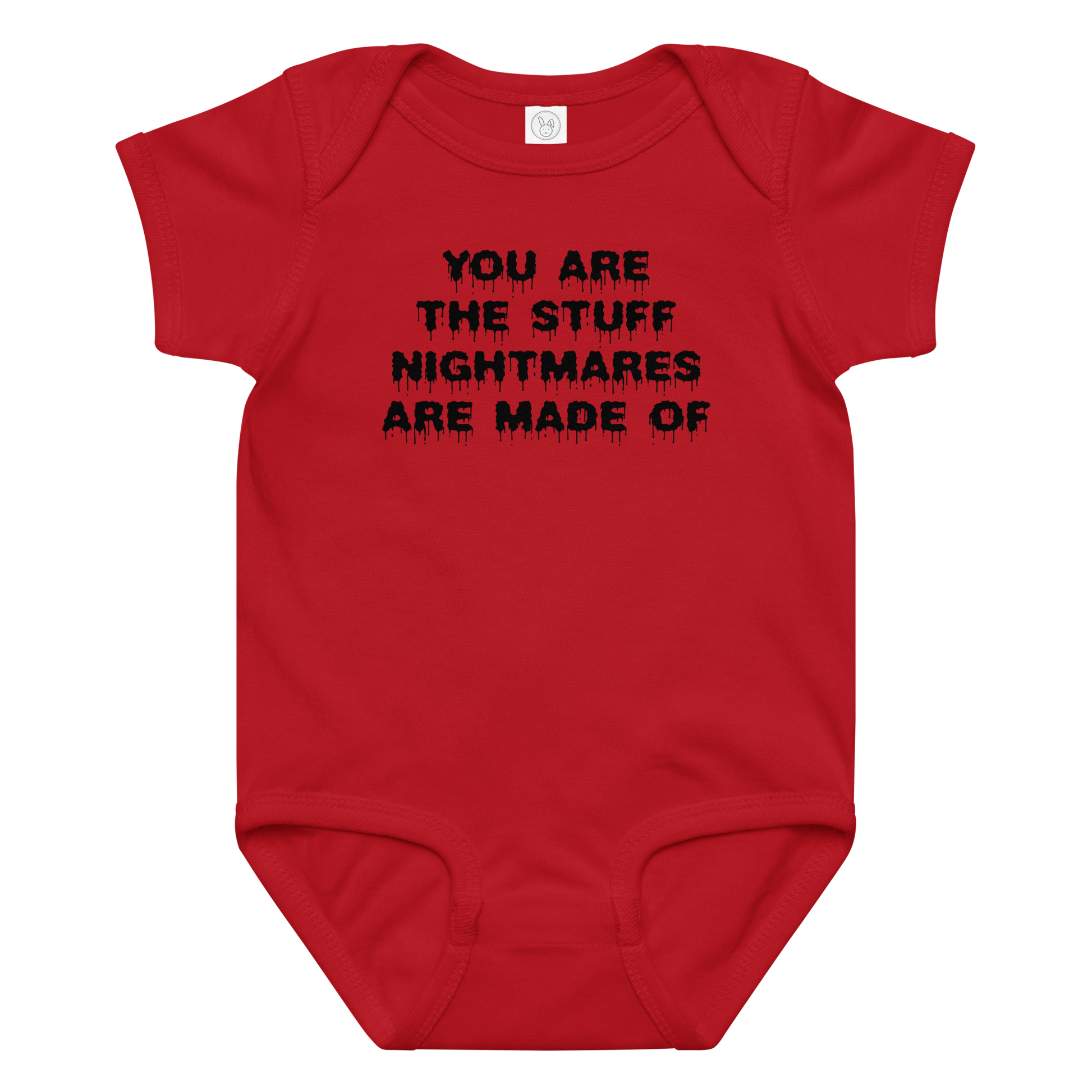 "You are the stuff nightmares are made of" printed on a red baby jersey bodysuit laying on a flat surface amongst other clothes