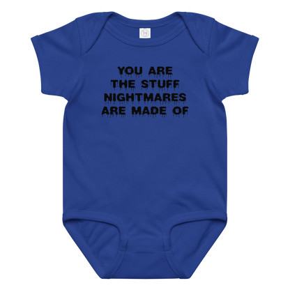 "You are the stuff nightmares are made of" printed on a royal baby jersey bodysuit laying on a flat surface amongst other clothes