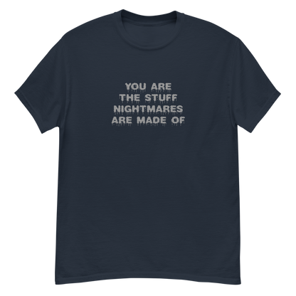 "You are the stuff nightmares are made of" printed on a navy unisex classic tee laying on a flat surface
