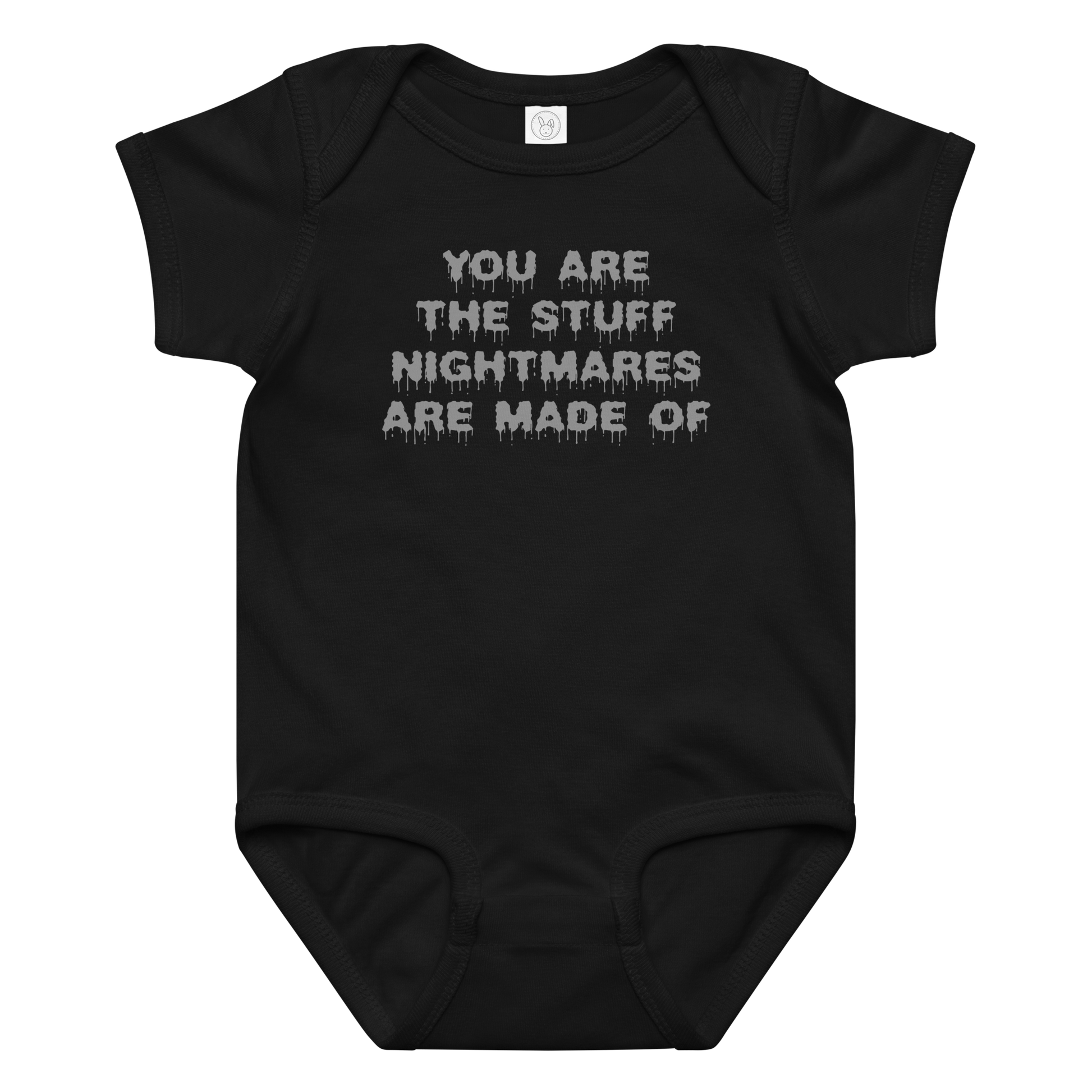 "You are the stuff nightmares are made of" printed on a black baby jersey bodysuit laying on a flat surface amongst other clothes