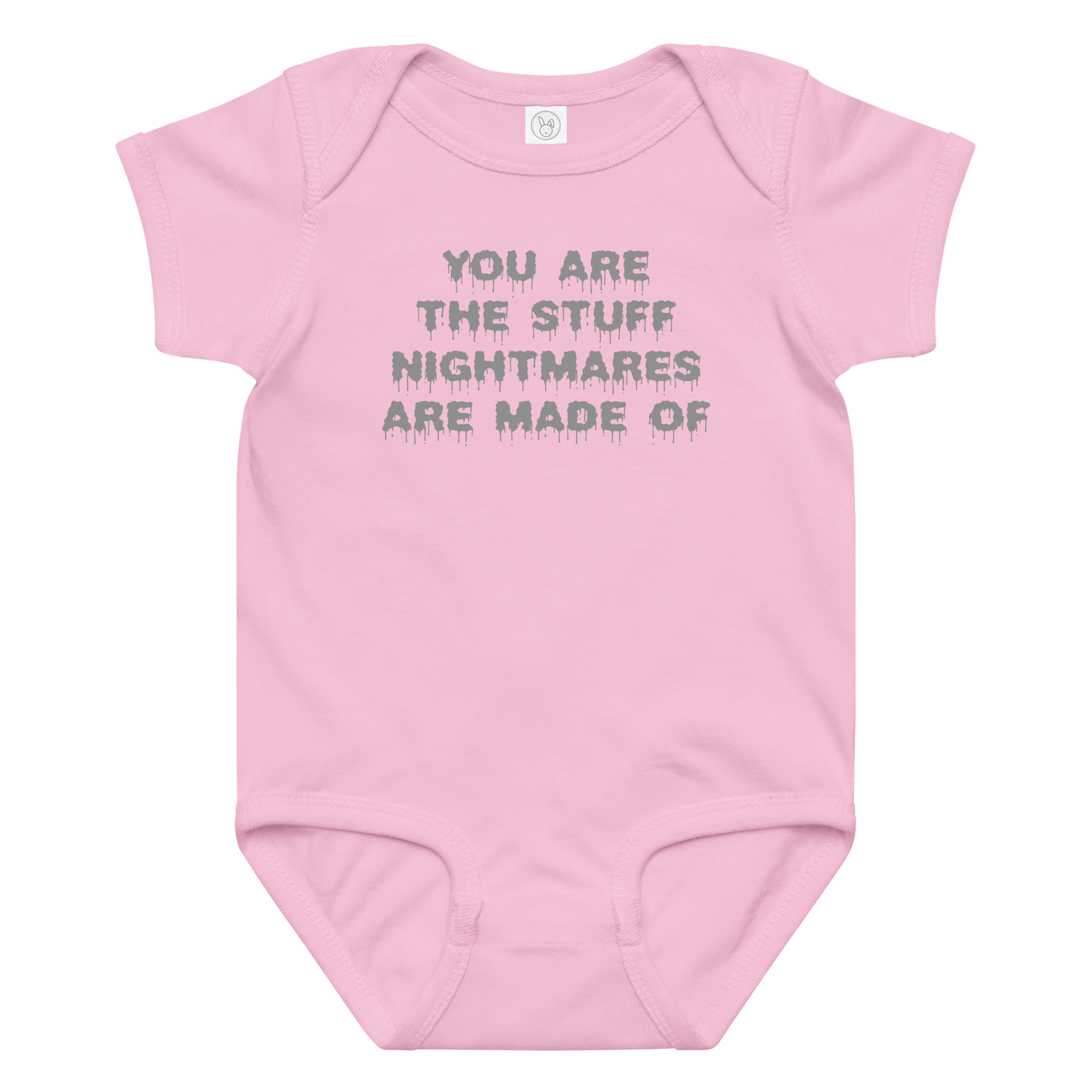 "You are the stuff nightmares are made of" printed on a pink baby jersey bodysuit laying on a flat surface amongst other clothes