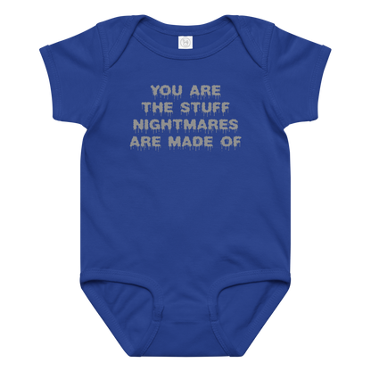 "You are the stuff nightmares are made of" printed on a royal baby jersey bodysuit laying on a flat surface amongst other clothes