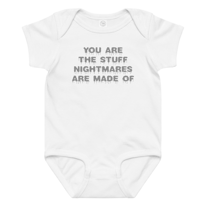 "You are the stuff nightmares are made of" printed on a white baby jersey bodysuit laying on a flat surface amongst other clothes