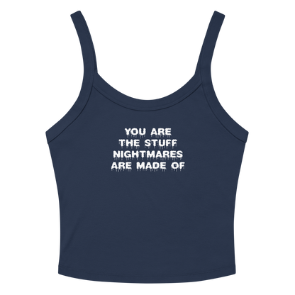 "You are the stuff nightmares are made of" printed on a solid navy blend women's micro-rib tanktop laying on a flat surface amongst sunglasses and shorts