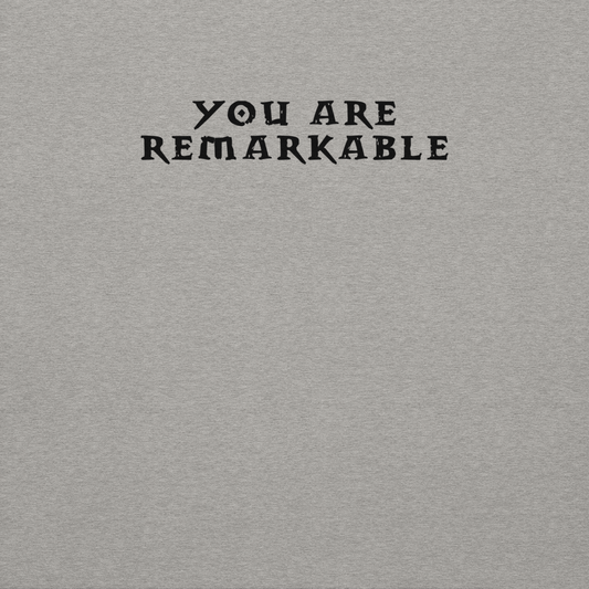 "You are remarkable" printed on a carbon grey background