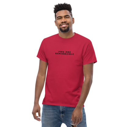 "You are remarkable" printed on a cardinal unisex classic tee worn by a male