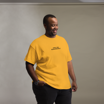 "You are remarkable" printed on a gold unisex classic tee worn by a male