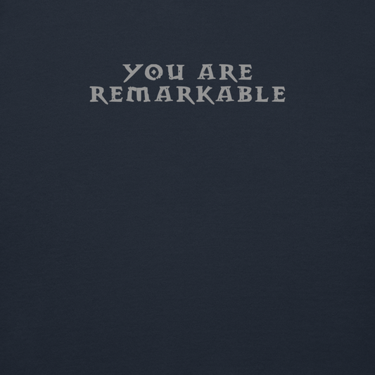 "You are remarkable" printed on a navy blazer background