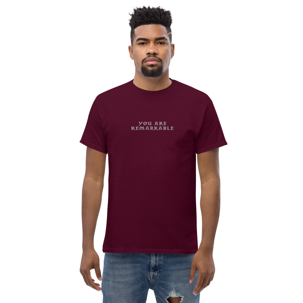 "You are remarkable" printed on a maroon unisex classic tee worn by a male