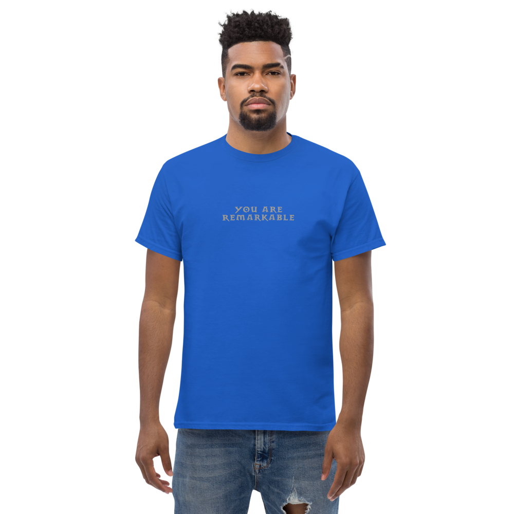 "You are remarkable" printed on a royal unisex classic tee worn by a male