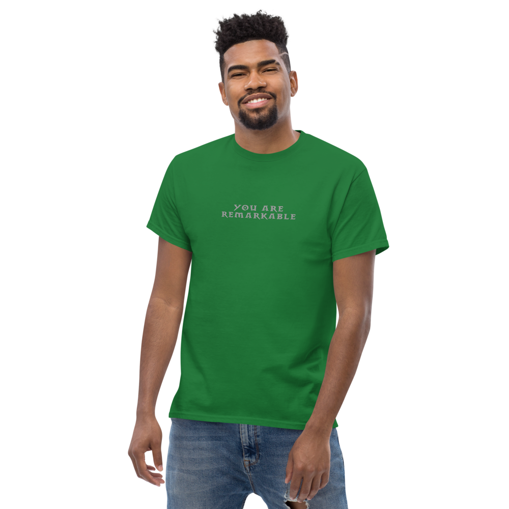 "You are remarkable" printed on a turf green unisex classic tee worn by a male