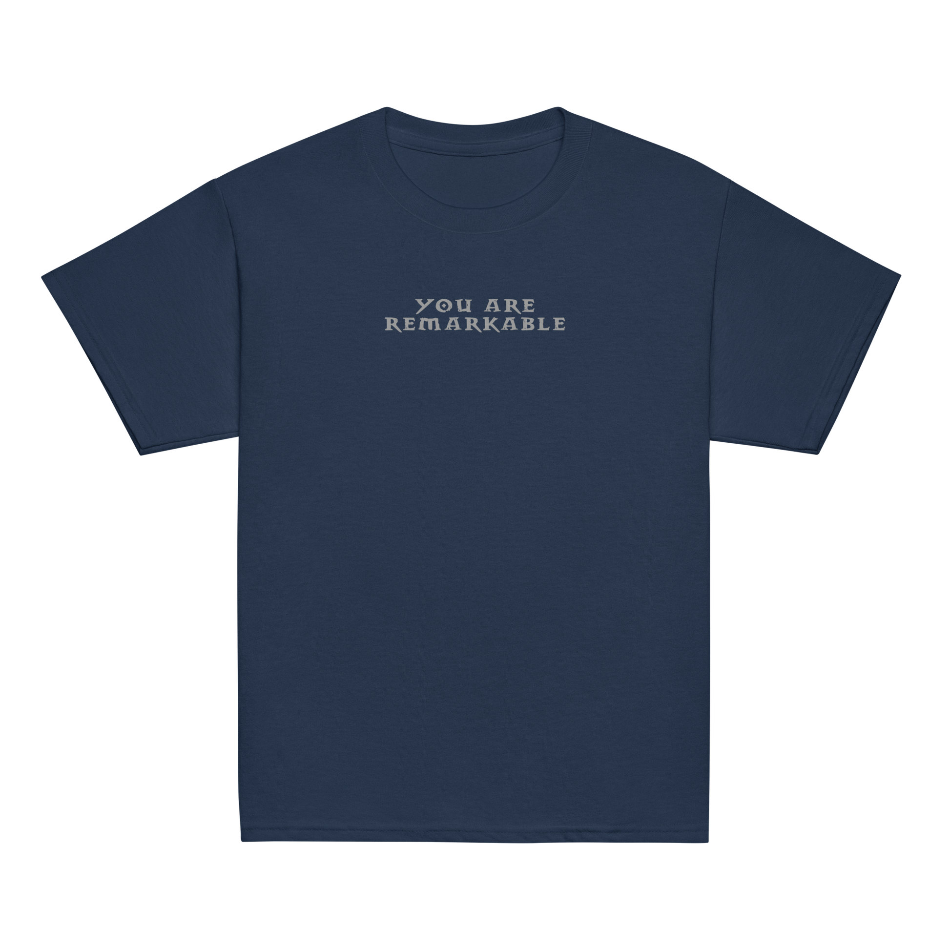 "You are remarkable" printed on a navy youth classic tee laying on a flat surface