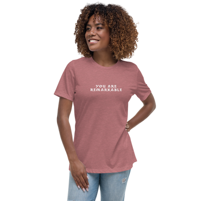 "You are remarkable" printed on a heather mauve women's relaxed t-shirt worn by a female