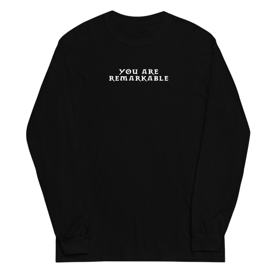 "You are remarkable" printed on a black men's long sleeve shirt laying on a flat surface